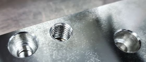 Close-up Threaded Hole and Counterbore Holes on Stainless Steel Plate
